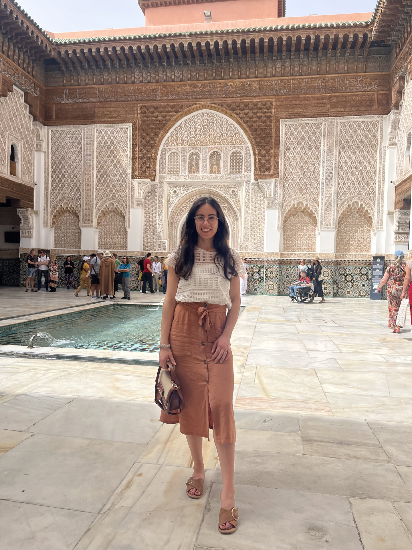 Joana standing in front of ornate architecture